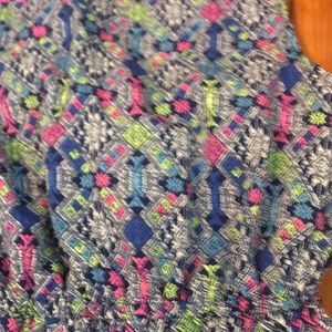 Blue pink and green kids romper.